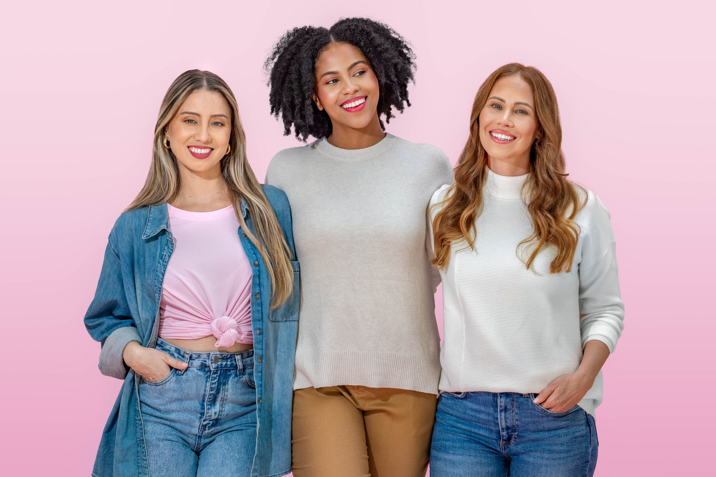 Three women smiling on pink background, showing Happy V’s feminine wellness spirit.
